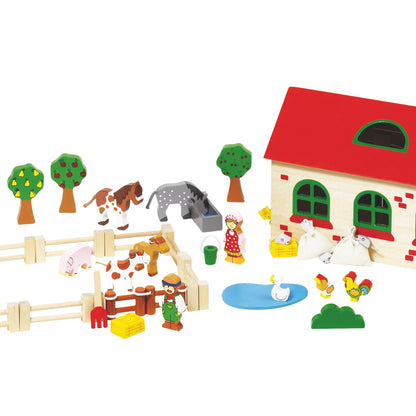 Vue intérieure de la ferme en bois avec espaces de jeu pour animaux